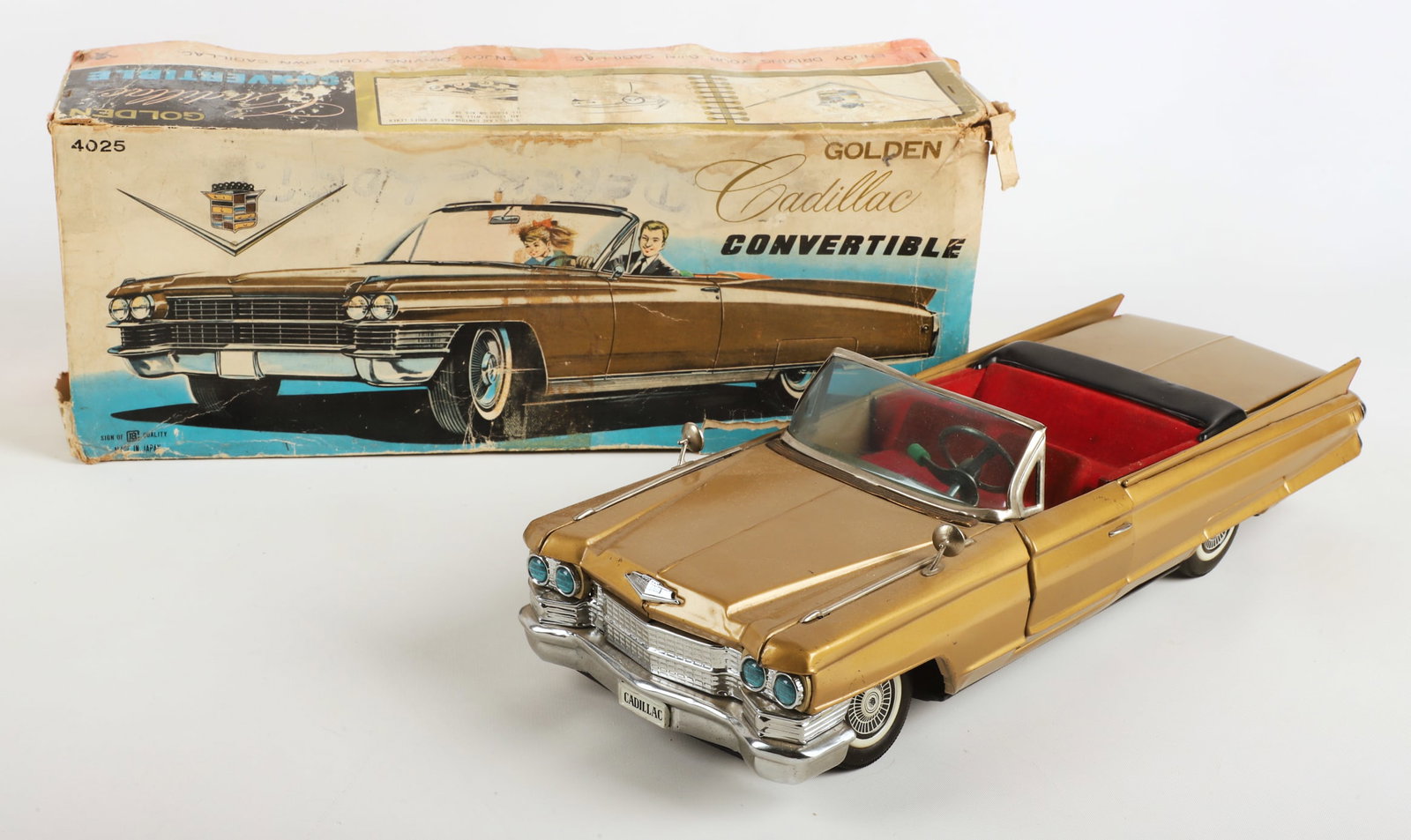 Bandai Golden Cadillac Convertible Toy 4025 1964: Bandai Golden Cadillac Convertible Toy 4025, 16 3/4"L, retains key, flocked interior, battery terminals clean, box included though in much disrepair.