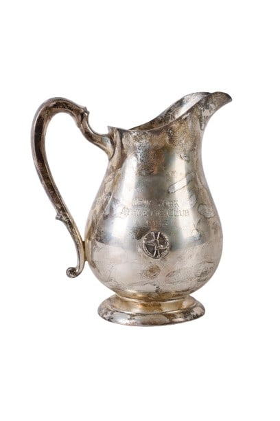 New York Athletic Club Sterling Pitcher 1956: New York Athletic Club Sterling Pitcher 1956, a sterling presentation pitcher reading 'New York Athletic Club 1956' at front, with a winged boot and crossed club emblem at front, with laurel wreath su