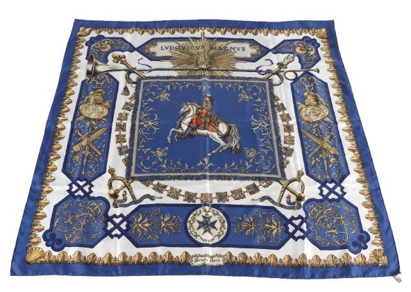 Hermes Ludovicus Magnus Silk Scarf: Hermes Ludovicus Magnus Silk Scarf designed by the artist Francoise de la Perriere and first issued in 1963. The scarf's print is inspired by the Sun King, one of France's most famous kings, Louis XIV
