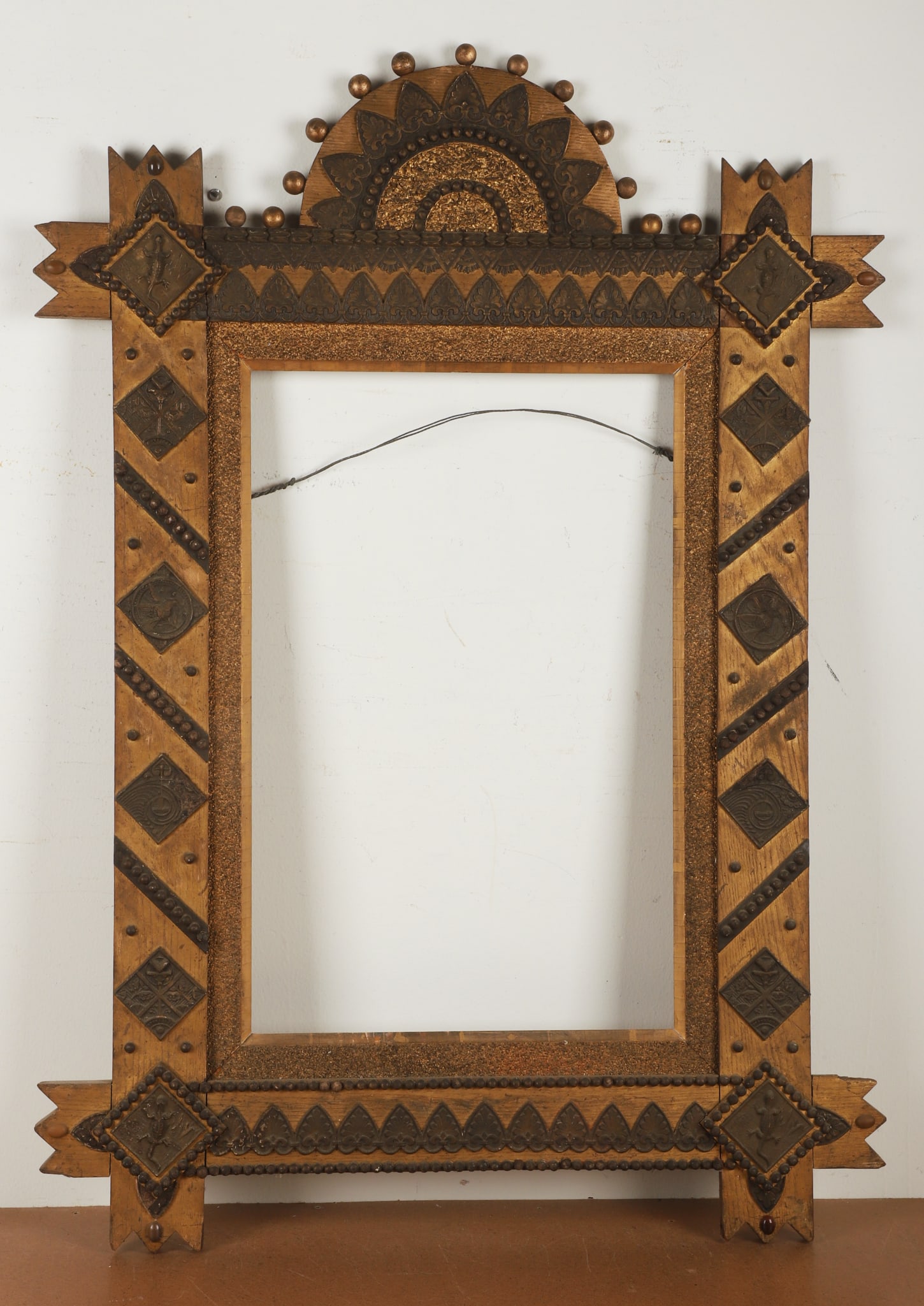 Aesthetic Folk Art Frame with Lizard Motifs: Aesthetic Folk Art Frame with Lizard Motifs, wood comprised with applied motifs and relief tiles, gold painted and patinated finish, 44"H x 31 1/2"W, interior 25 1/2"H x 16 3/4"W, good condition, wear