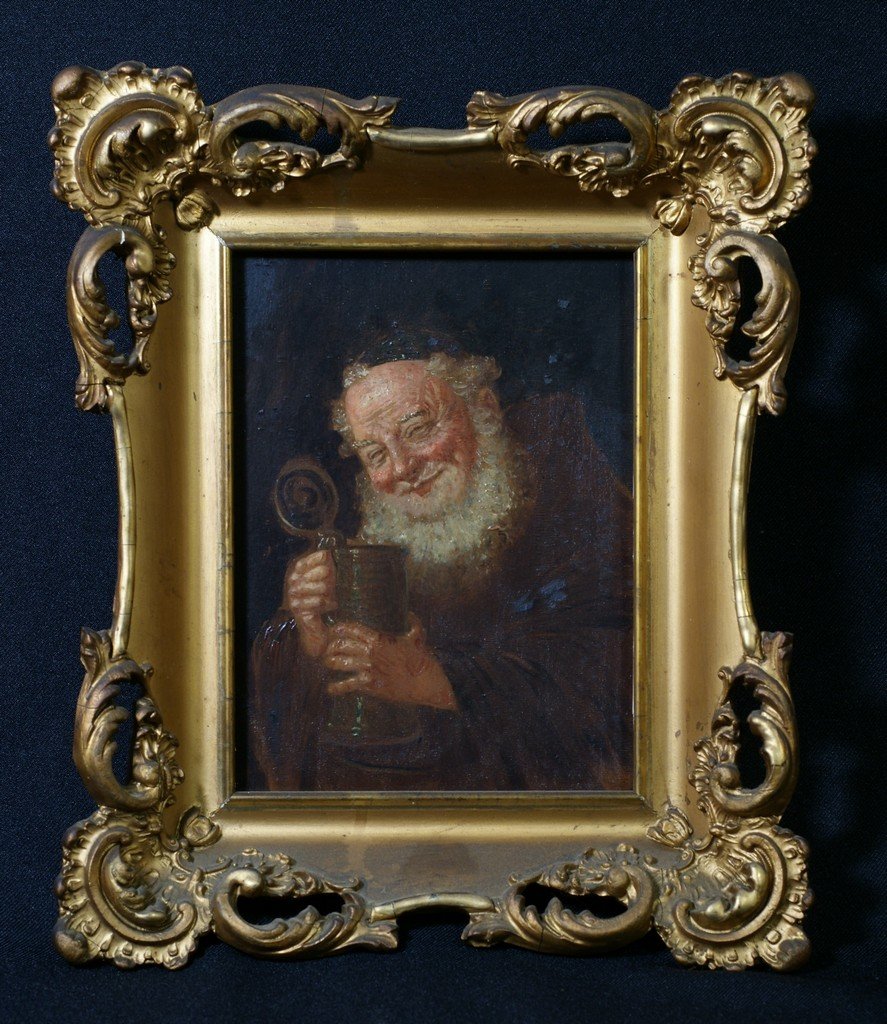 Continental School, 19th/20th c, o/chamfered maho: Continental School, 19th/20th c, o/chamfered mahogany panel, Smiling Monk with Beer Stein, 8" x 6", pierced gilt frame