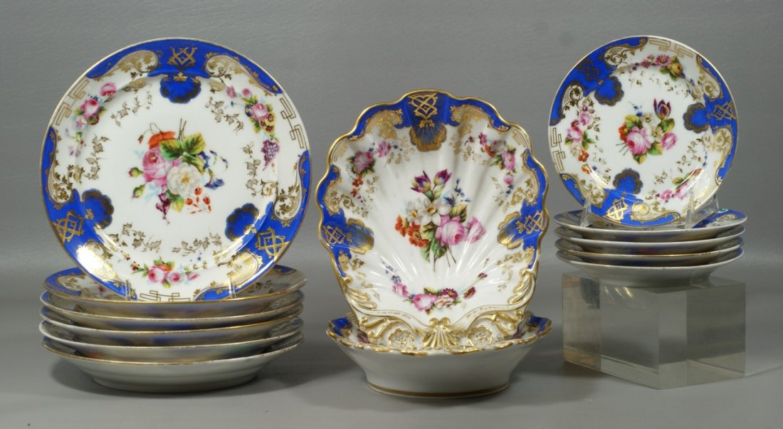 (13) pcs Paris porcelain tableware, c/o 2 10" shell dis: (13) pcs Paris porcelain tableware, c/o 2 10" shell dishes, (6) 9 1/2" plates, (5) 7" plates, blue borders, gilt and floral designs, minor wear to gold, generally very good condition