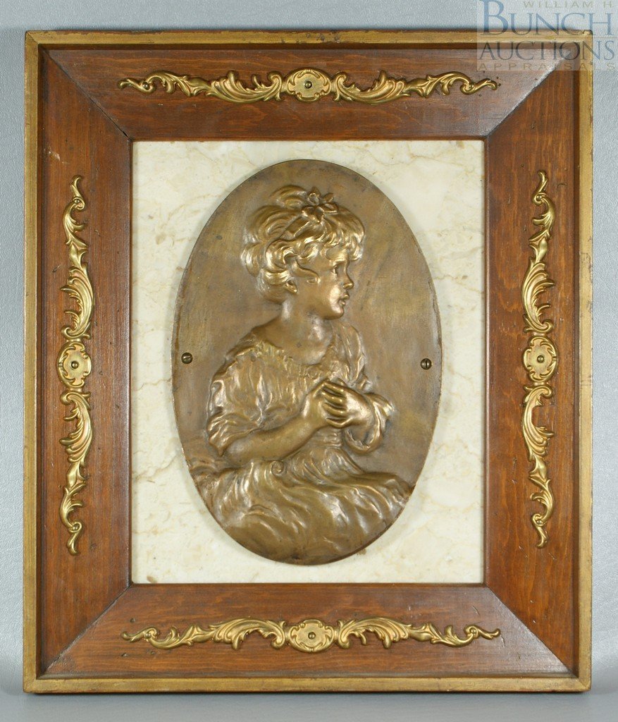 MSG monogrammist, oval bronze plaque of a young girl, m: MSG monogrammist, oval bronze plaque of a young girl, mounted on a stone plaque, in a wood metal trimmed frame, 16" x 13 1/2" overall