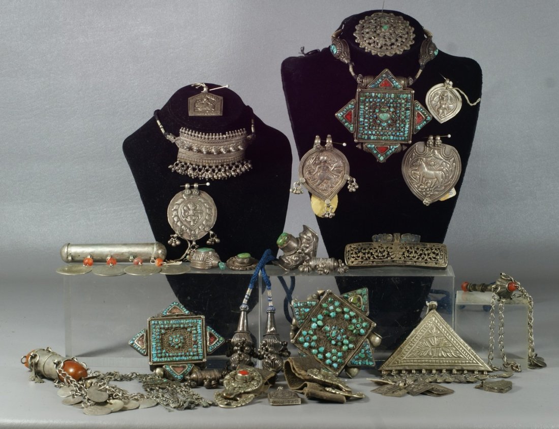 Lot of Asian unmarked silver or base metal jewelry incl: Lot of Asian unmarked silver or base metal jewelry including 3 turquoise set prayer holders, other pendants, necklaces, rings, about 25 pieces in all