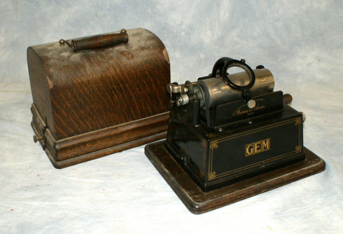 Edison Gem cylinder phonograph, with an ill fitted Mode: Edison Gem cylinder phonograph, with an ill fitted Model H 4 minute reproducer, some veneer loss to case, no horn