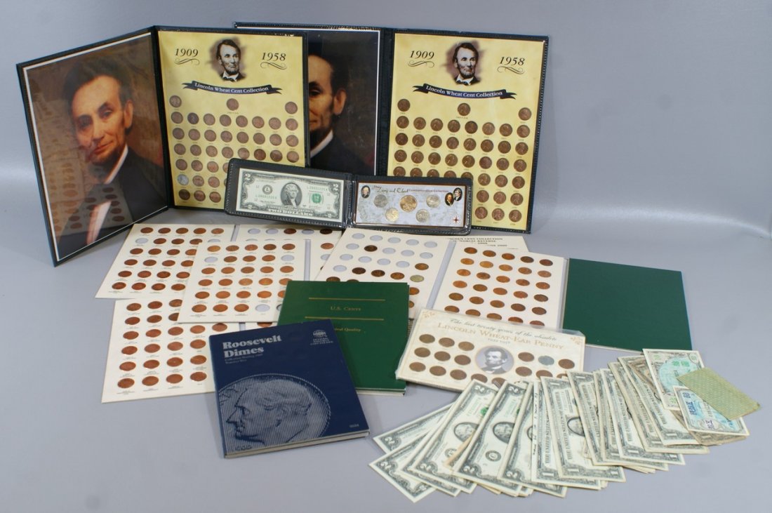 A coin and currency lot consisting of 25 $1 silver cert: A coin and currency lot consisting of 25 $1 silver certificates, 20 Bicentennial $2 bills, and about 10 various folders of Lincoln cents and clad dimes