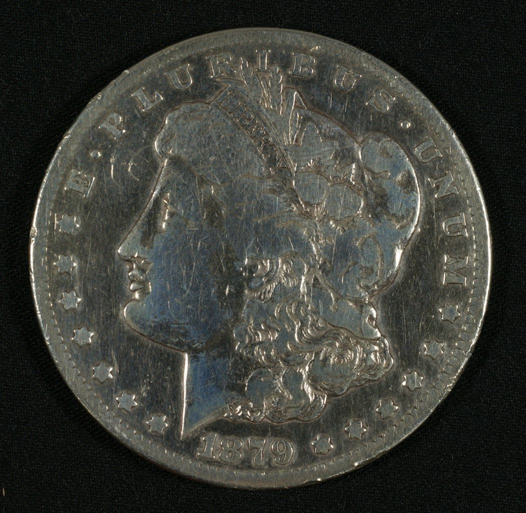 1879 cc Morgan dollar G/VG rim nicks and polished: 1879 cc Morgan dollar G/VG rim nicks and polished