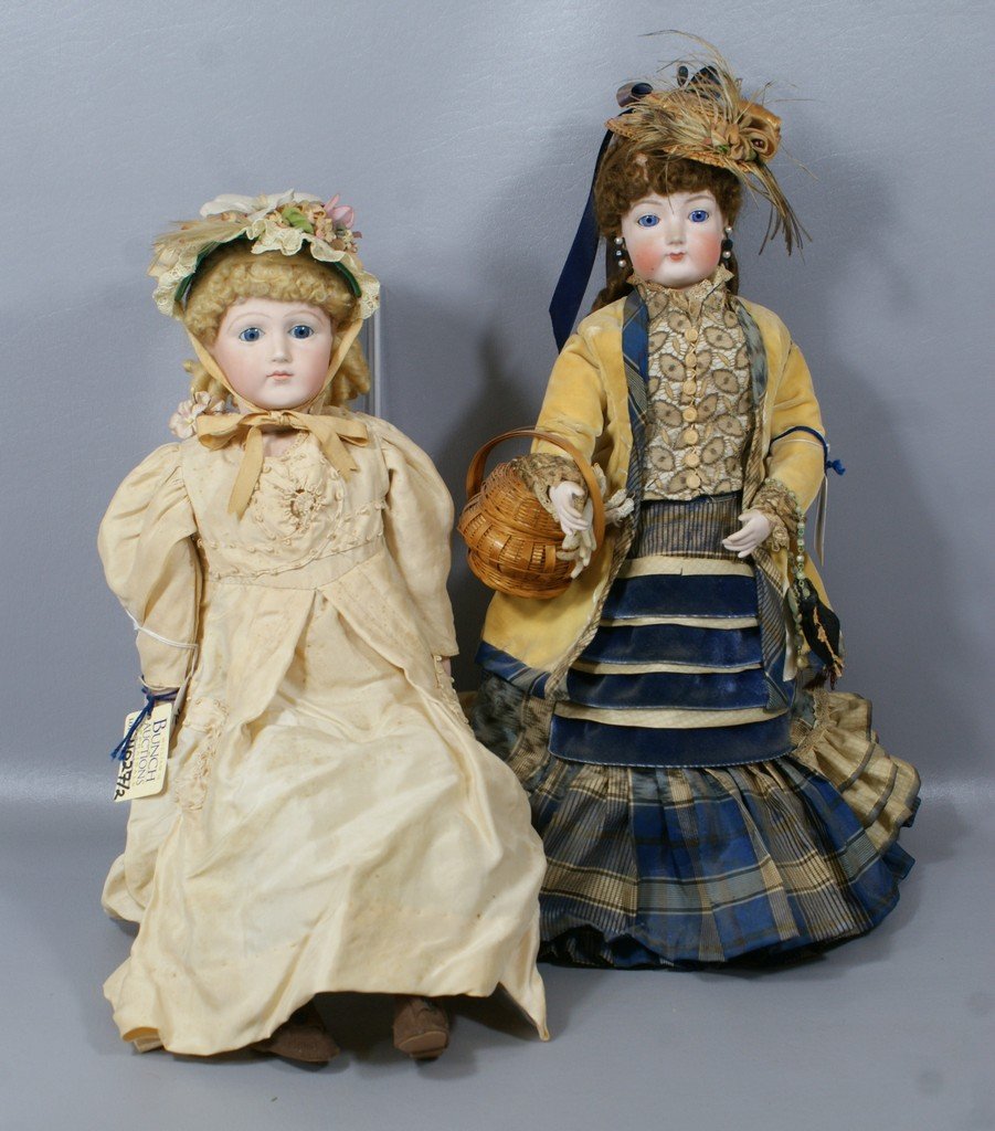 2 Reproduction French Fashion Dolls, doll with colorful: 2 Reproduction French Fashion Dolls, doll with colorful outfit meant to represent an F.G. doll and the blond to represent a Jumeau, both 17"