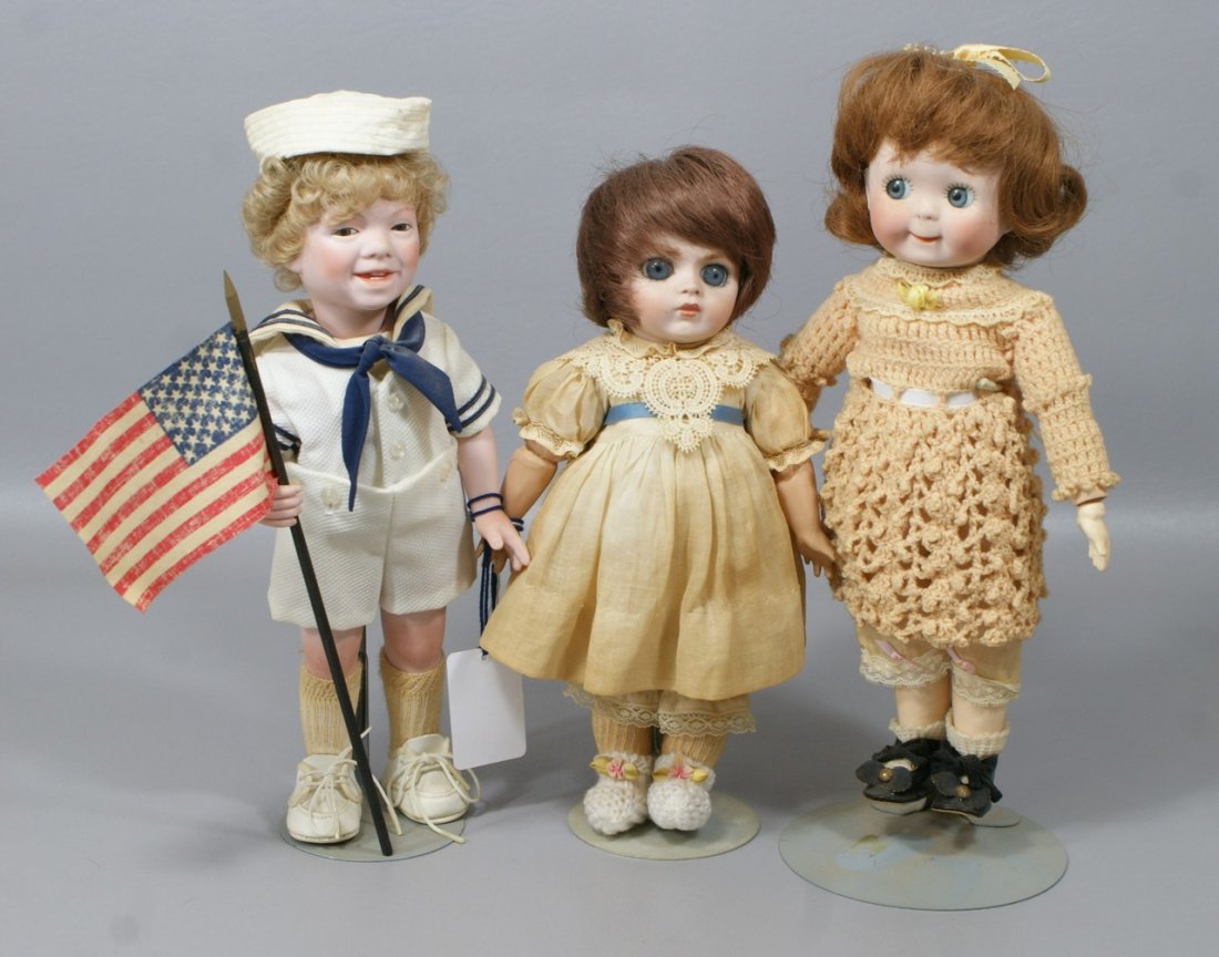 3 Bisque Artist Dolls, 2 wide-eyed reproductions of Ger: 3 Bisque Artist Dolls, 2 wide-eyed reproductions of German googlies, smiling boy is a UFDC convention souvenir doll representing John Clendenien as a young boy, tallest 11"