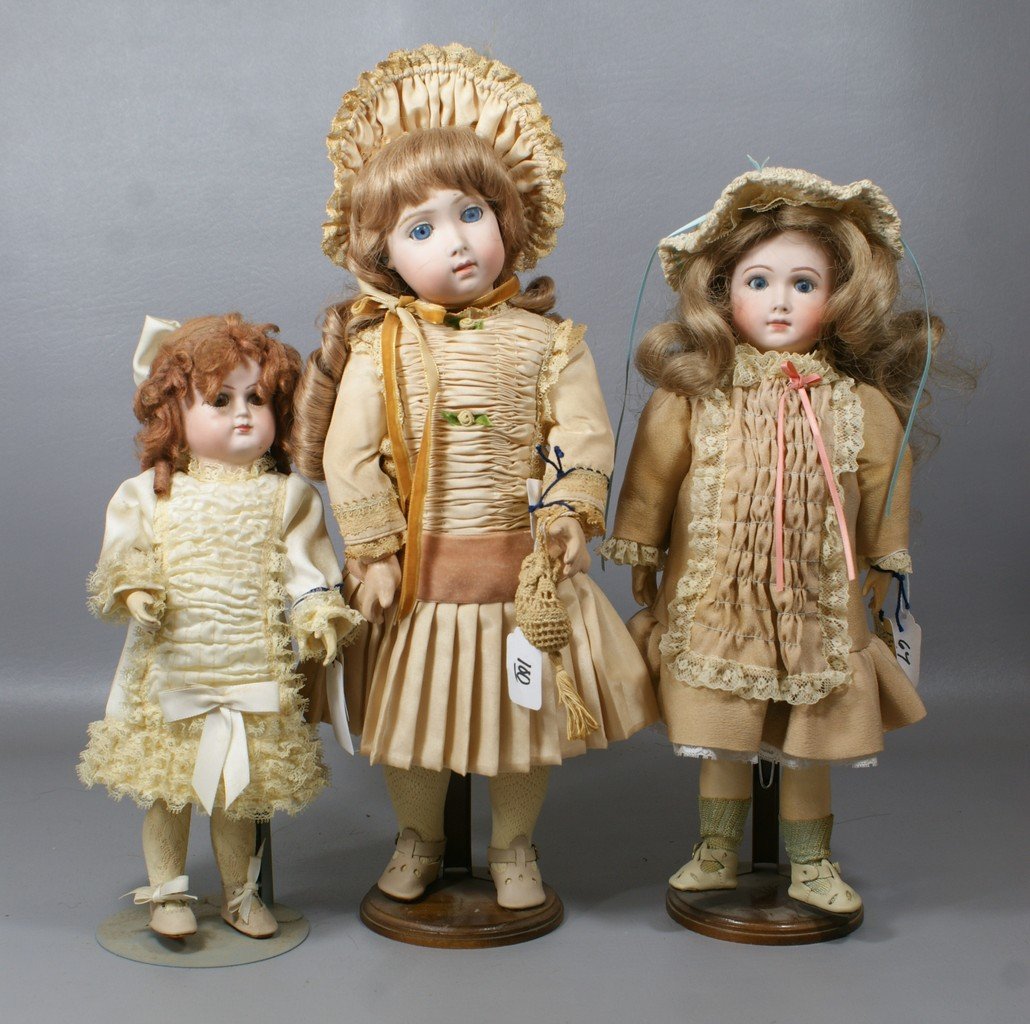 3 Reproduction French Bisque Dolls, largest is a replic: 3 Reproduction French Bisque Dolls, largest is a replica of Jumeau Triste, along with an "AT" and Schmitt, largest 16"