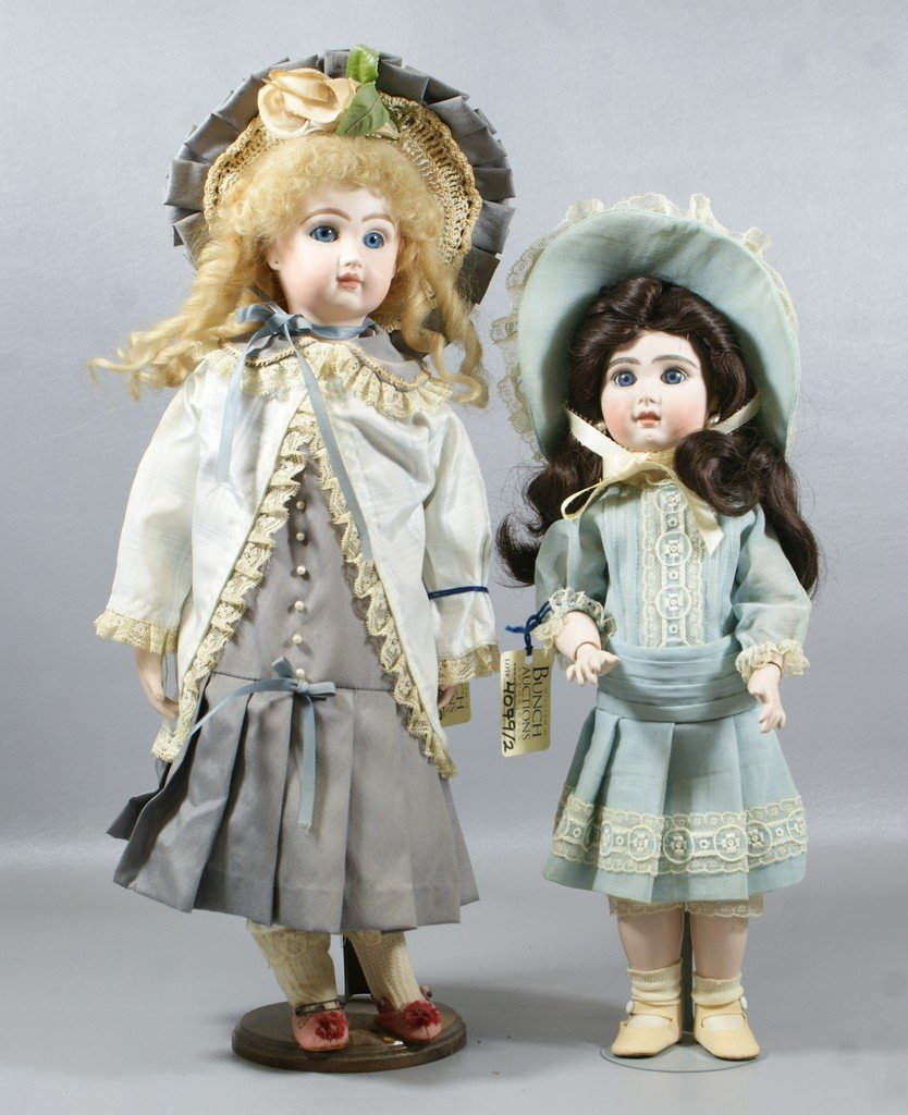 2 Reproduction Jumeau Dolls, larger is on a cloth body : 2 Reproduction Jumeau Dolls, larger is on a cloth body with bisque forearms, smaller on a fully articulated body, tallest 16"
