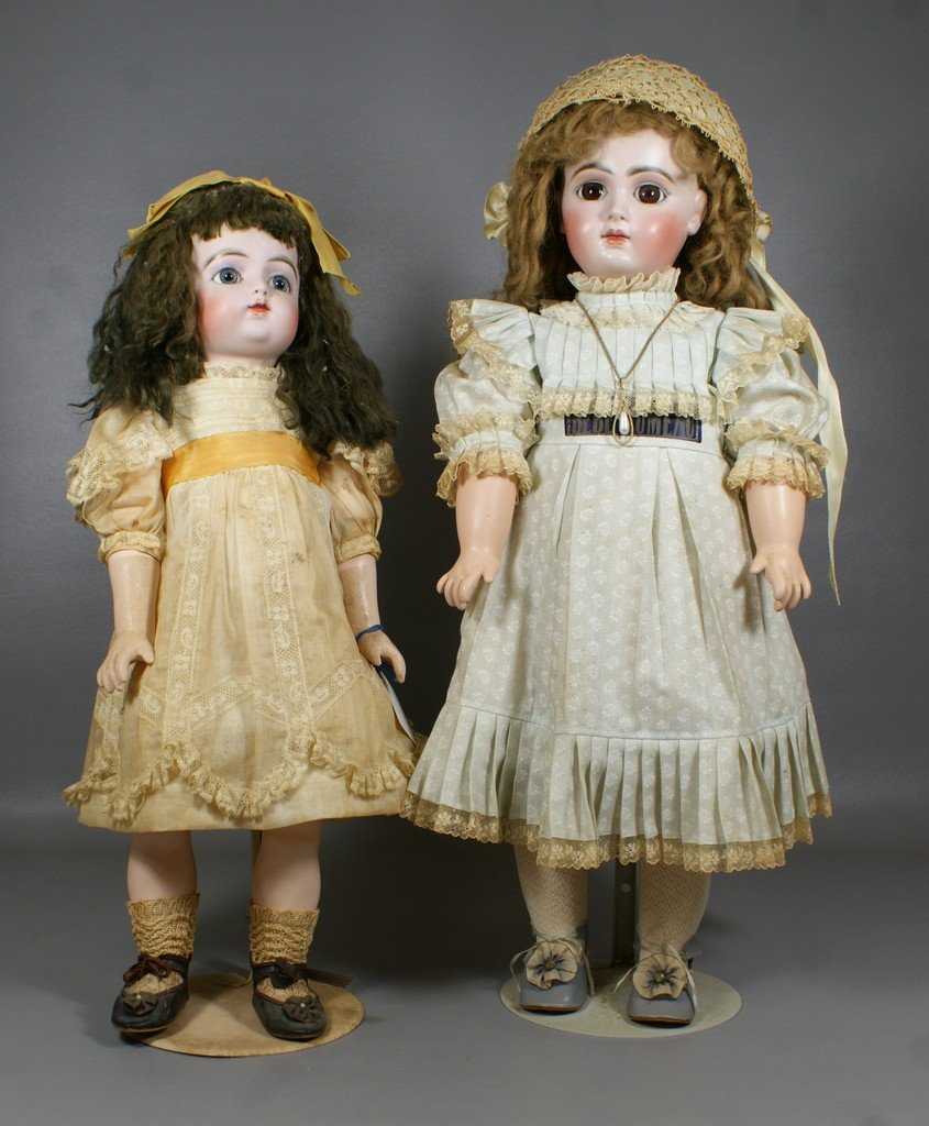 2 Reproduction French Bisque Dolls, larger is a copy of: 2 Reproduction French Bisque Dolls, larger is a copy of an "EJ Jumeau" and the smaller an "FG", tallest 22"