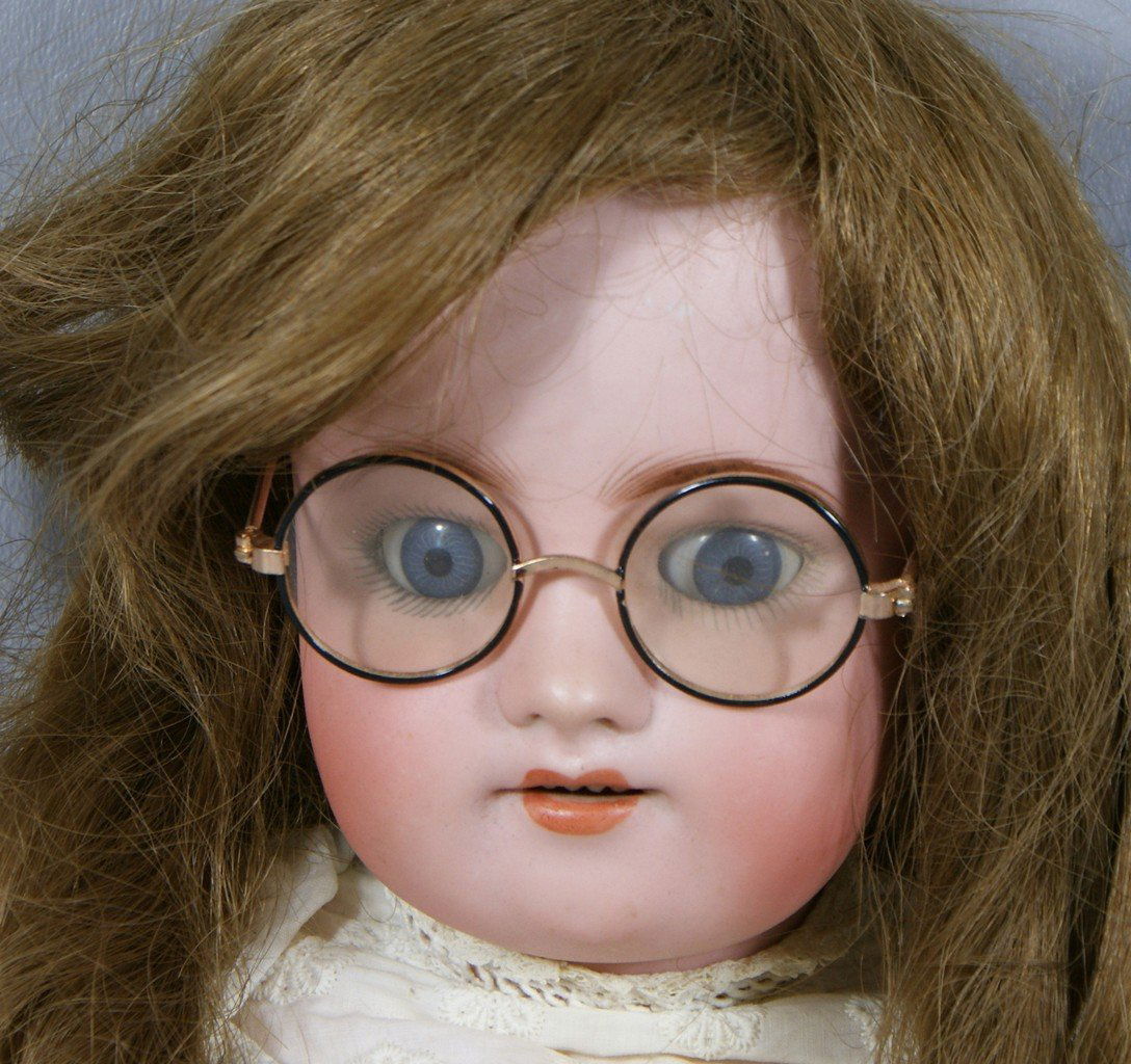 German Bisque Head Doll, head incised "570 Germany Simo: German Bisque Head Doll, head incised "570 Germany Simon & Halbig S & H", on a fully jointed wood and compo body, blue glass sleep eyes, open mouth with 4 upper teeth, 2 hairlines, 21"