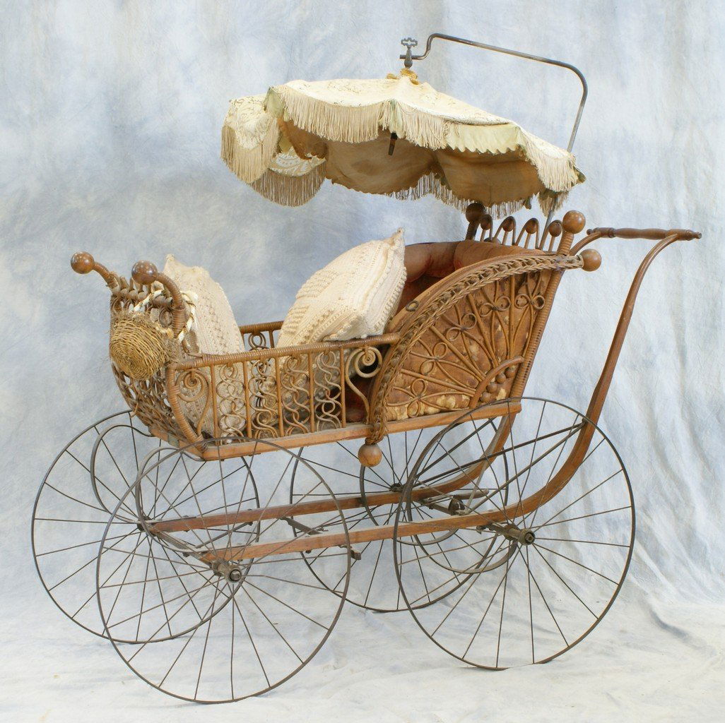 Wicker Baby Carriage, steel wheels, parasol top, with s: Wicker Baby Carriage, steel wheels, parasol top, with steel suspension, worn velvet upholstered interior, about 53" high
