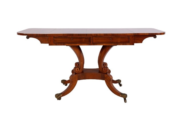 Regency dropleaf console table: Regency dropleaf console table, exotic wood, two drawers w/ brass escutcheons and banded beading, key with tassel, back side two faux drawers, scrolled supports, over star-shaped base, w/ stylized Cab