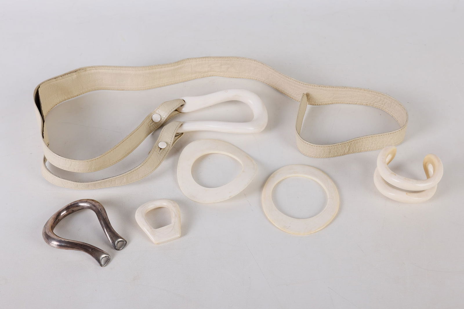 Elsa Peretti Bone and Sterling Belt and Bracelets: Elsa Peretti Bone and Sterling Belt and Bracelets to include an Elsa Peretti for Halston cuff bracelet, with repair, (2) attributed bangle bracelets, most likely part of the Halston collection in the