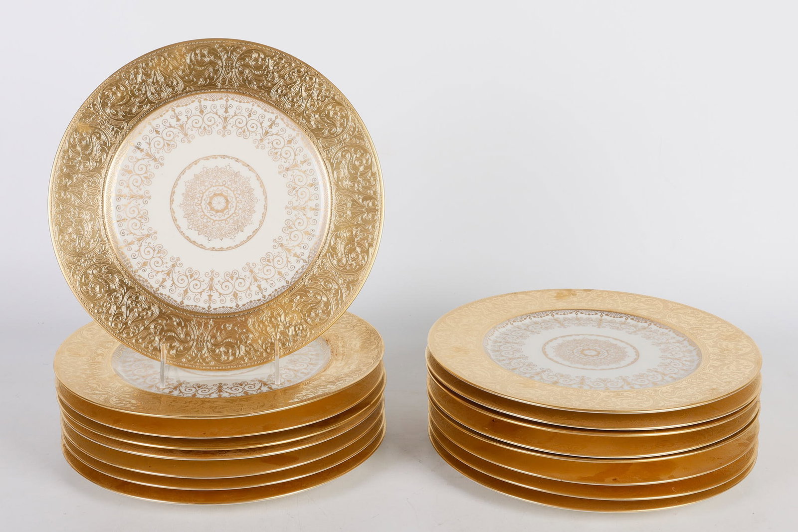 (16) Heinrich and Co. Selb Gilt Place Plates: (16) Heinrich and Co. Selb Gilt Place Plates, gilt encrusted edge with gilt decorated center, retailed by Bailey Banks and Biddle, 11" dia