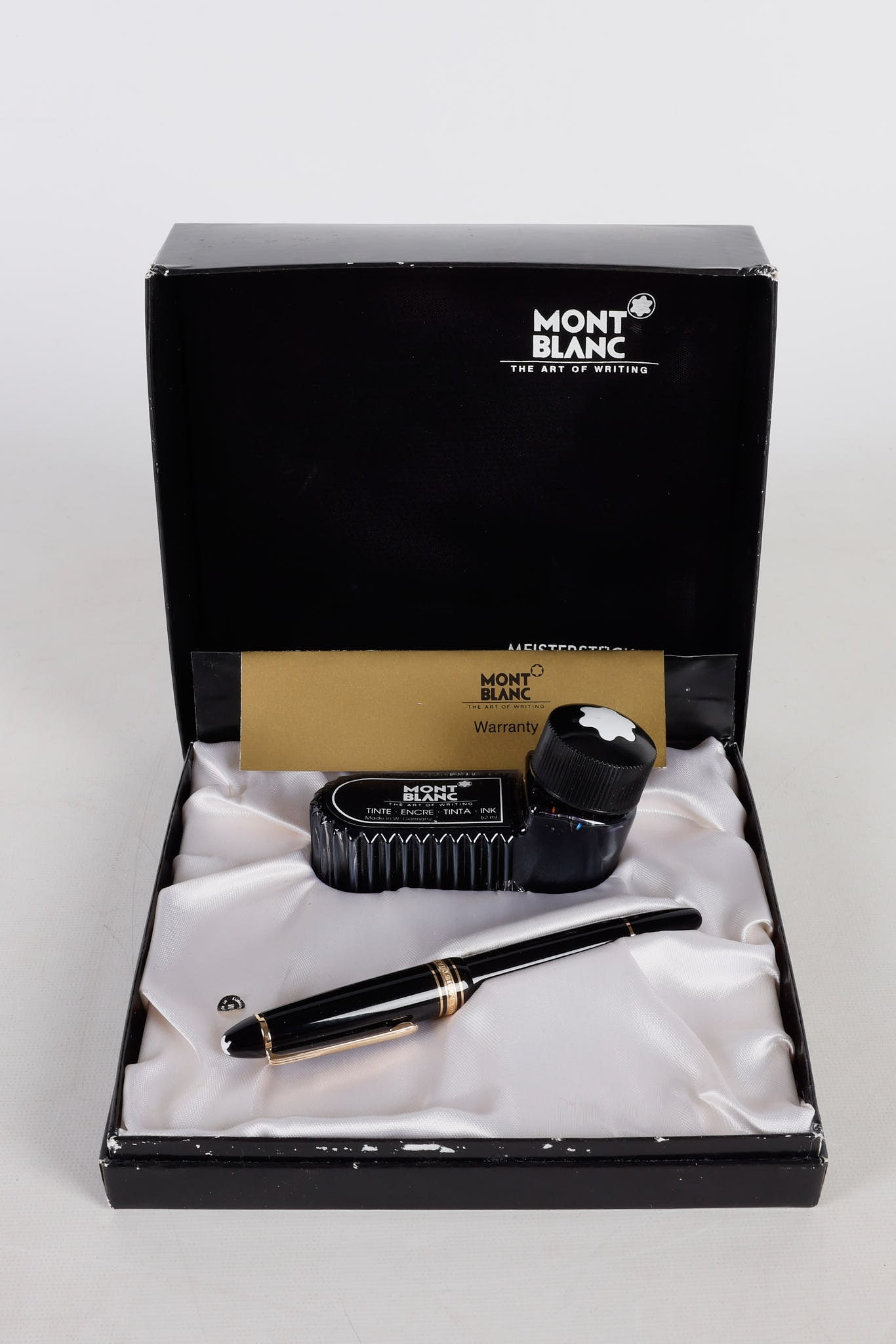 Montblanc Meisterstuck Fountain Pen: Montblanc Meisterstuck Fountain Pen, 14K 4810 nib, 5 5/8"L, ink dried in chamber, the clip band reading 'Germany', in original box with ink, ink apparently still fluid.
