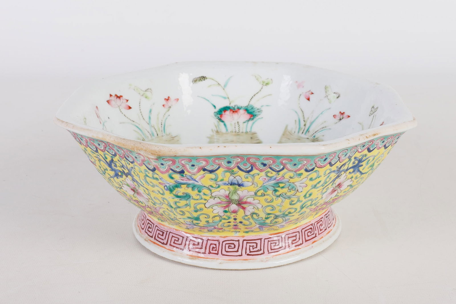 Chinese Yellow Famille Rose Bowl: Chinese yellow Famille Rose bowl, octagonal form with yellow ground and floral decoration, (6) character mark on underside, 3 3/4"h x 9 3/4 diam., very good condition