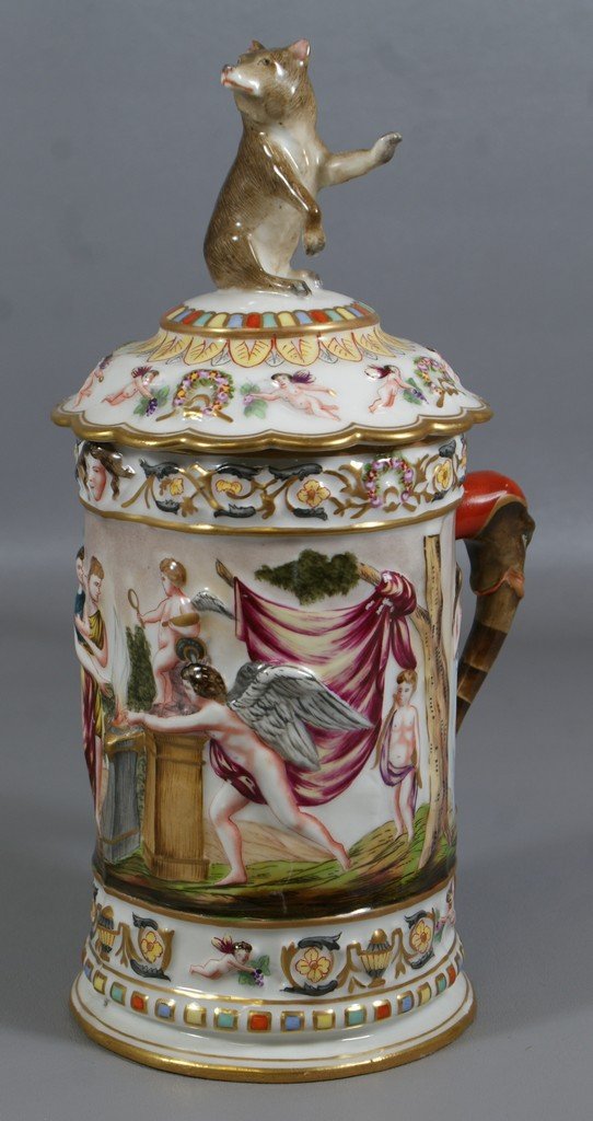 Capodimonte porcelain stein, body with raised classical: Capodimonte porcelain stein, body with raised classical figure decoration, elephant head handle, standing bear finial, 11 3/8" tall, blue underglaze crowned N mark, no damage