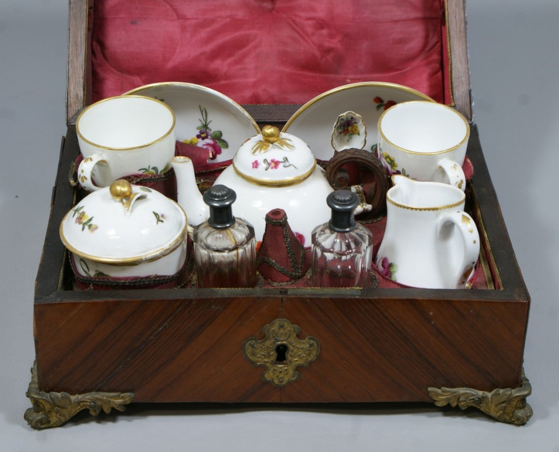 Cased Paris Porcelain travel tea set, mark of Le Courti: Cased Paris Porcelain travel tea set, mark of Le Courtille, Jean Baptiste Locre, late 18th/19th c, c/o teapot with carved wood handle, cream pitcher, sugar bowl, 2 cups, 2 saucers, 2 spoons (each brok