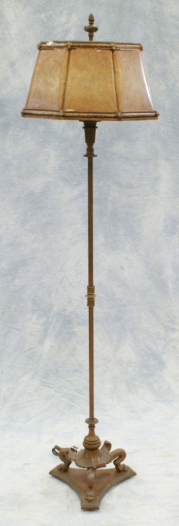 Bronze floor lamp with original celluloid shade, base w: Bronze floor lamp with original celluloid shade, base with animal foot and shell design, 65"h