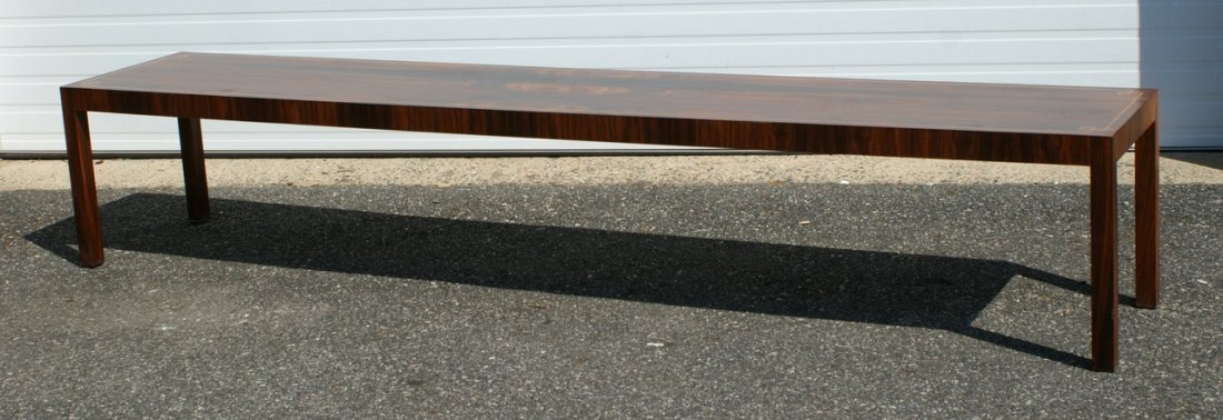 Custom made rosewood veneered mid century design long t: Custom made rosewood veneered mid century design long table with line inlay around border, 110"l 20"w 20"h