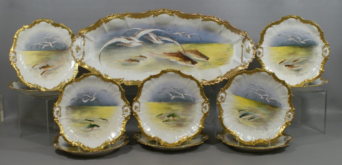 11 pc Imperial Limoges porcelain fish set, long platter: 11 pc Imperial Limoges porcelain fish set, long platter, 24 1/2", repaired at one end, artist signed Valentin, 10 small plates, 9 1/4" d, no damage to these