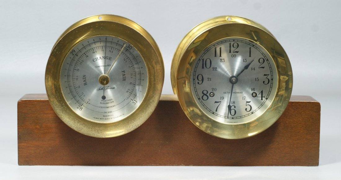 Seth Thomas Corsair ship's clock and barometer desk set: Seth Thomas Corsair ship's clock and barometer desk set, 4" dials, on mahogany base, mid 1960's, 14" w