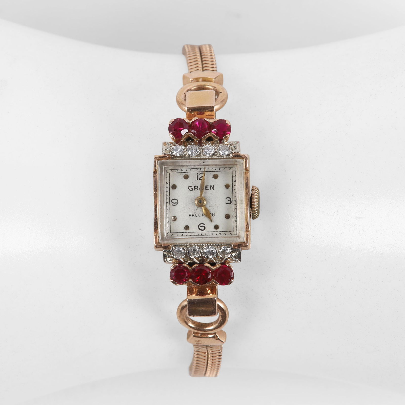 14K Diamond and Ruby Gruen Ladies Bracelet Watch: 14K Diamond and Ruby Gruen Ladies Bracelet Watch, Swiss 17 jewel movement, the interior of case back signed Gruen Watch Co. 14K 263383, (8) round cut diamonds flank the square case, 1.5 mm each, with