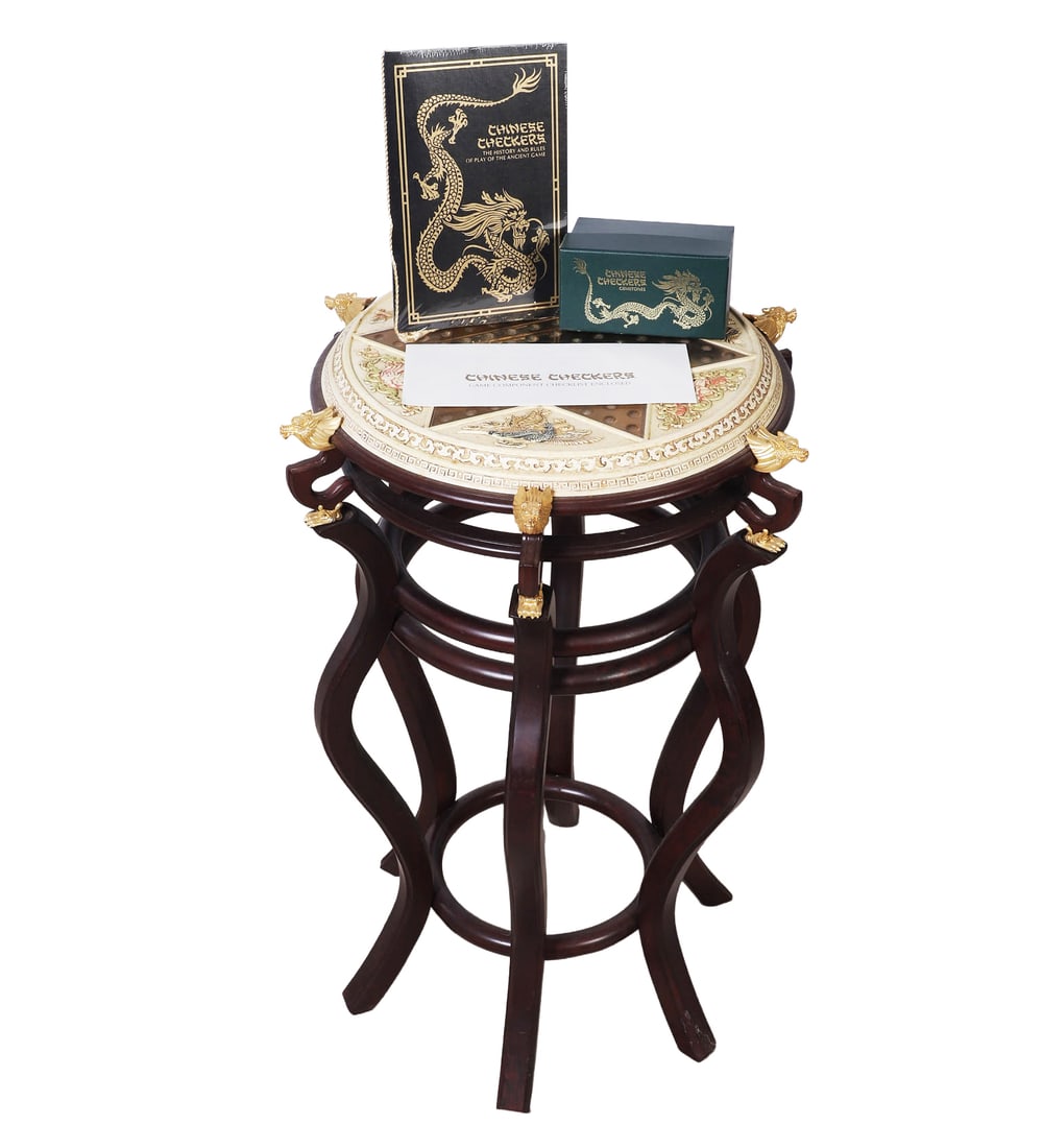 Franklin Mint Chinese Checkers Games Table: Franklin Mint Chinese checkers games table, in two pieces, table top w/decorative brass dragon's head embellishments, rules and history booklet, games pieces, 29"H x 20"Dia.