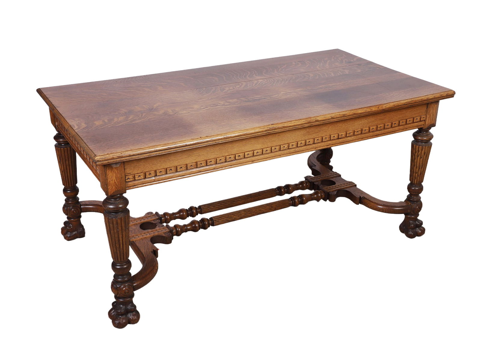 Victorian Tiger Oak Library Table: Victorian tiger oak library table, random width board top, repeating rectangular geometric block pattern, w/hole drilled in center, on decorative apron, two "hidden" drawers at table ends disguised