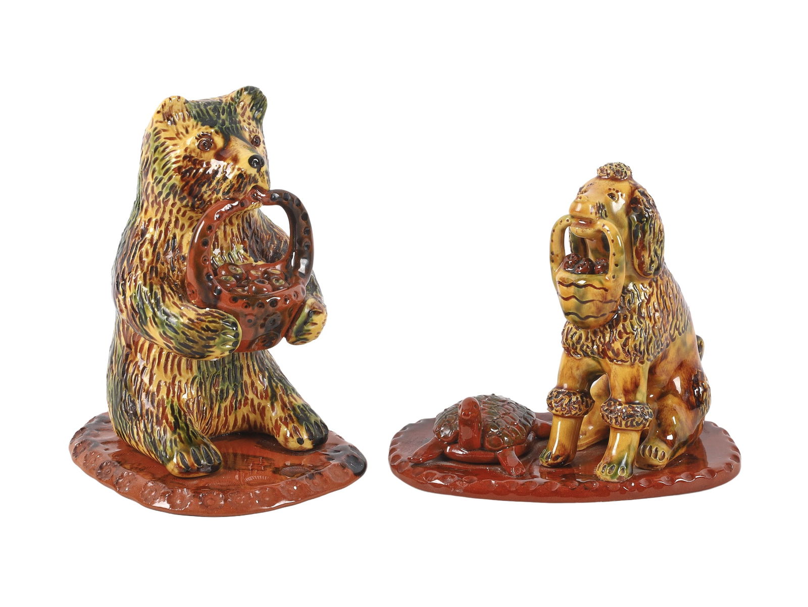 Two Breininger Pottery Redware Animal Figures.: Two Breininger Pottery Redware Animal Figures. Both yellow ground with green mottled glaze on slab bases. Standing bear with a basket of apples hanging from mouth, dated 2001, 7.5" h., approx. 6" x 5"