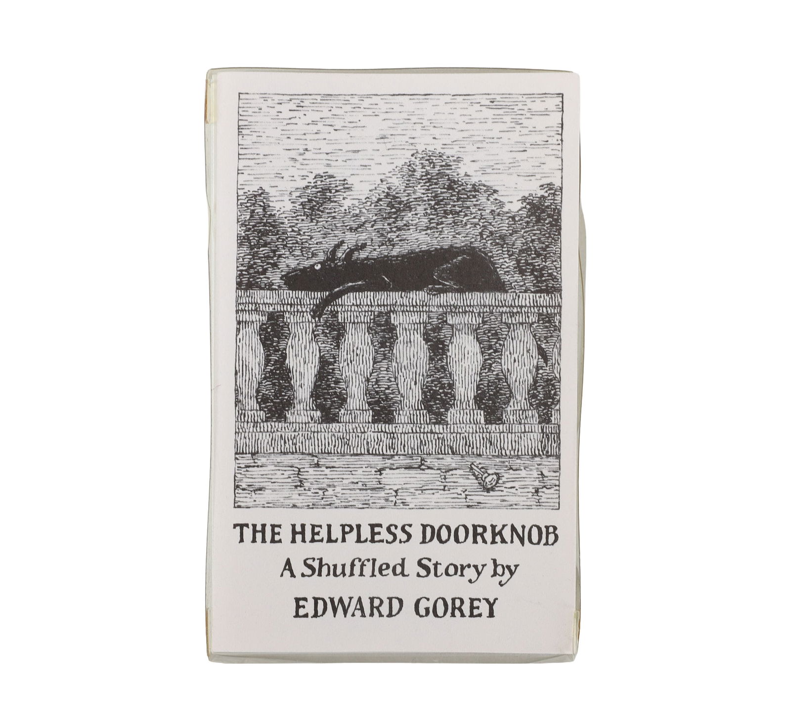 The Helpless Doorknob, Edward Gorey Signed: "The Helpless Doorknob, A Shuffled Story" by Edward Gorey. Signed, fourth printing, 1989, of which was 500 sets. Increasingly rare. In original plastic case. Size: 4.25" H x 2.75" W.