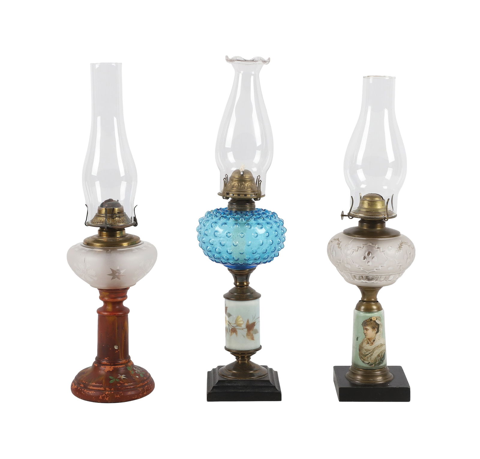 (3) Decorative Oil Lamps With Pressed Glass Fonts: (3) Victorian Oil Lamps to include a Banner Frosted Glass Font figural oil lamp, cast Iron figural stem depicts woman kneeling with a slate base, Eagle Pressed Glass Font Oil Lamp on a floral