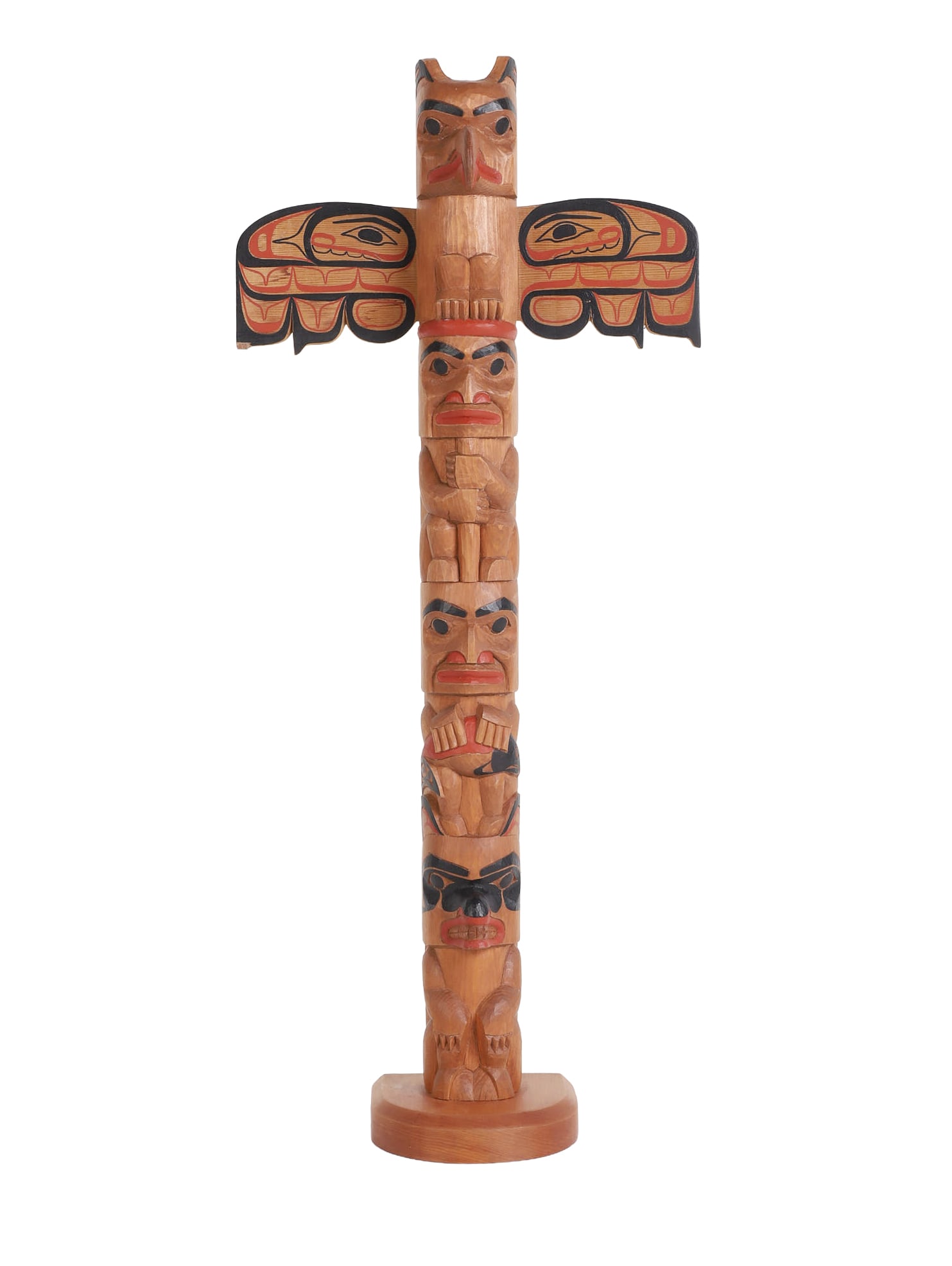 David A. Boxley Carved and Painted Totem Pole: David A. Boxley Carved and Painted Totem Pole featuring an eagle crest with outstretched wings stacked on human and animal figures, Signed and dated David Boxley 1993 in ink on underside, 25" h,