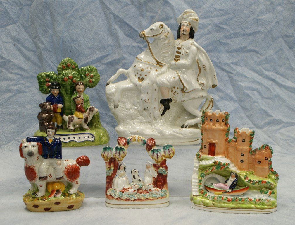 (5) Staffordshire figurines, Windsor Castle spill vase,: (5) Staffordshire figurines, Windsor Castle spill vase, hairlines, 6 3/4", Man on horse, chip on his cape, 10 1/2" h, Children with toys, 6 1/2" tall, boy with spaniel, 6" tall, 2 children with dog an