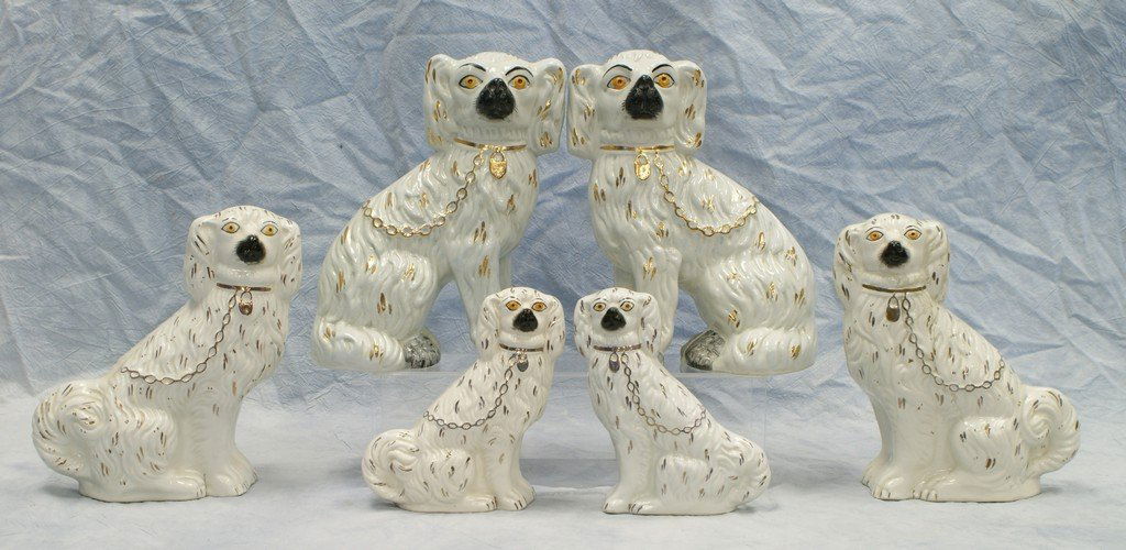 (3) pr Staffordshire King Charles spaniels, white with: (3) pr Staffordshire King Charles spaniels, white with gilt leashes, graduated 10 1/4", 9 1/2", (one with cracks) 7", 20th c stamp