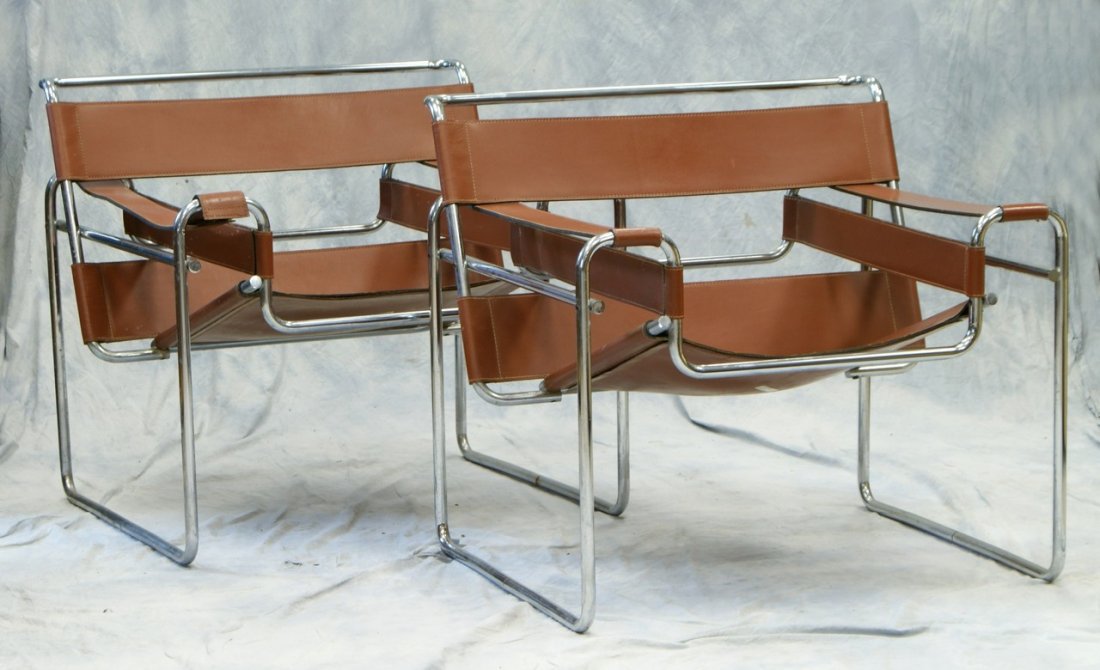 Marcel Breuer for Knoll, pr Wassily chairs in chromed: Marcel Breuer for Knoll, pr Wassily chairs in chromed steel with brown leather. Knoll International label. 29'' x 31'' x 28'', one arm leather needs restitching, chrome with some imperfections