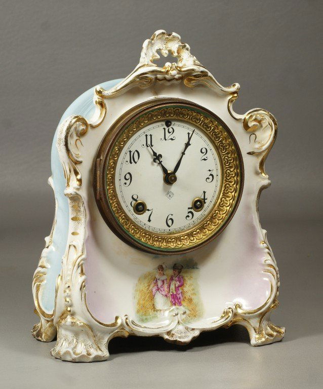 Ansonia KPM porcelain case mantle clock, 8 day t&s,: Ansonia KPM porcelain case mantle clock, 8 day t&s, empaneled dial, pale blue and gilt case with transfer scene of a young couple, 9 3/4" h,