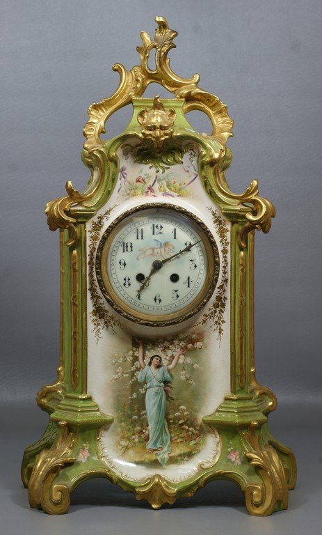 Louis XV style Royal Bonn china case clock, green and: Louis XV style Royal Bonn china case clock, green and ivory with gilt trim, transfer scenes of a maiden and flowers on front & sides, left rear leg restored, J Marti movement, enameled dial, 21" tall,