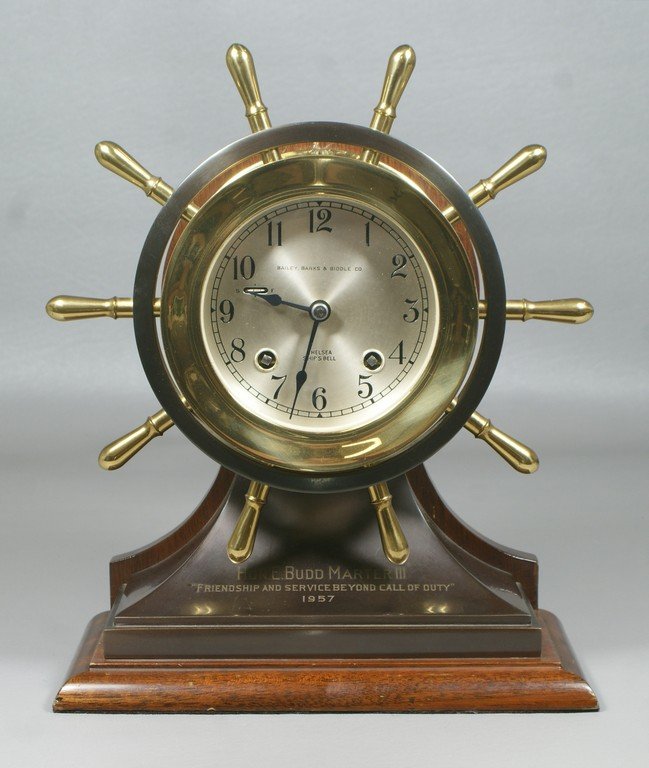 Chelsea ship's wheel clock, base engraved "Hon E Budd: Chelsea ship's wheel clock, base engraved "Hon E Budd Marter III, Friendship and Service Beyond call of Duty, 1957", mahogany base, 4" dial
