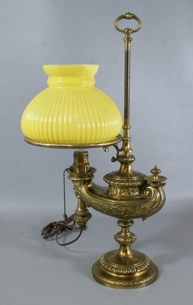 Wild and Wessel, Berlin brass Aladdin student lamp with: Wild and Wessel, Berlin brass Aladdin student lamp with yellow cased shade, electrified, 21 1/2" tall