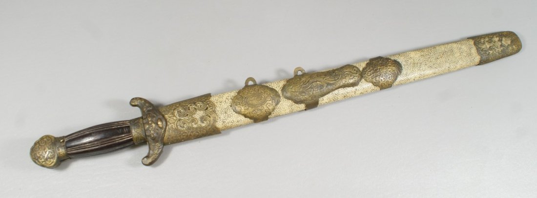 Set Indo-Chinese dao knives, or hudiedao, also called: Set Indo-Chinese dao knives, or hudiedao, also called butterfly swords, carved teak or rosewood handles, cast and engraved brass/bronze fittings, double sided blades, fitted into a sheath with a singl