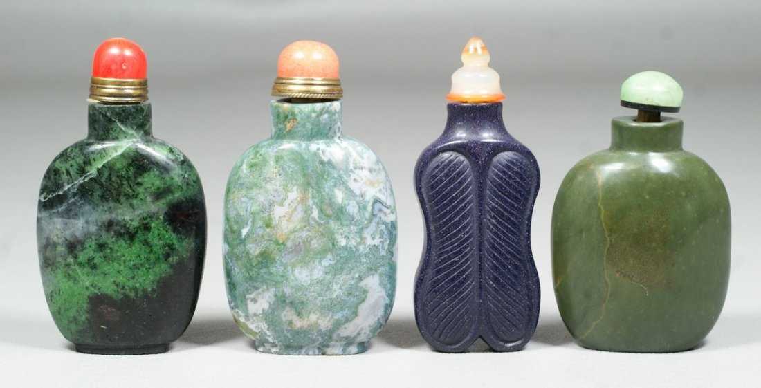 4 Chinese green and dark stone snuff bottles,: 4 Chinese green and dark stone snuff bottles, coral/jade/other stoppers, tallest 3 1/8"