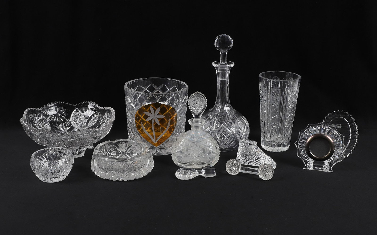 Large Group Of Clear Glassware: Large Group Of Clear Glassware Large Group Of Clear Glassware to include Large Bohemian Vase WIth Engraved Floral Motif, measuring 7" tall, Picture Frame, Signed Waterford, measuring 5" tall, Lead Cry