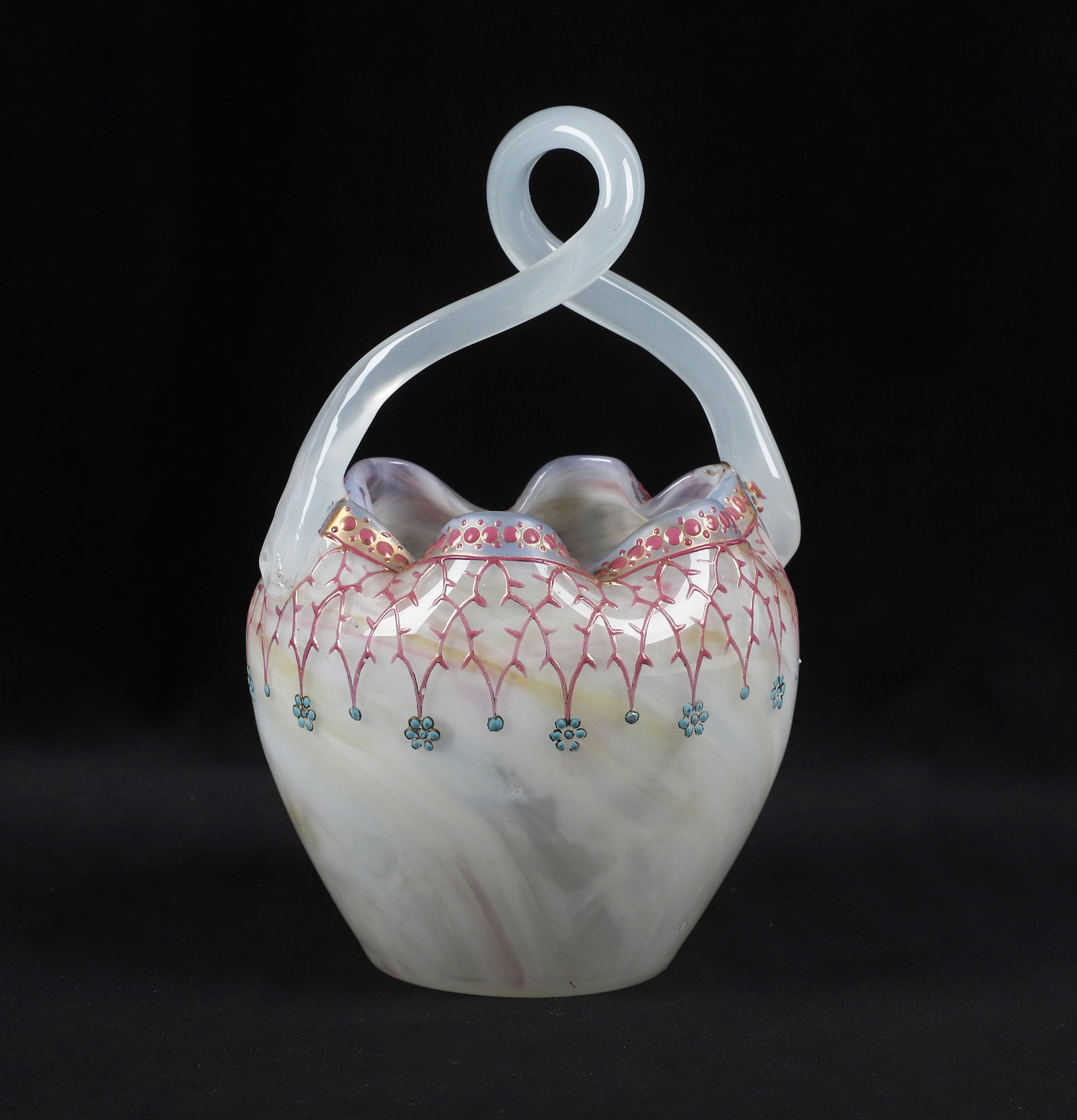 Hand Blown Enameled Glass Flower Basket: Hand Blown Enameled Glass Flower Basket Hand blown opalescent art glass flower basket. Ruffled rim, twist handle eye-catching pink enamel decoration with gilt finish. No makers marks. 5"l x 5"w x 7 3/