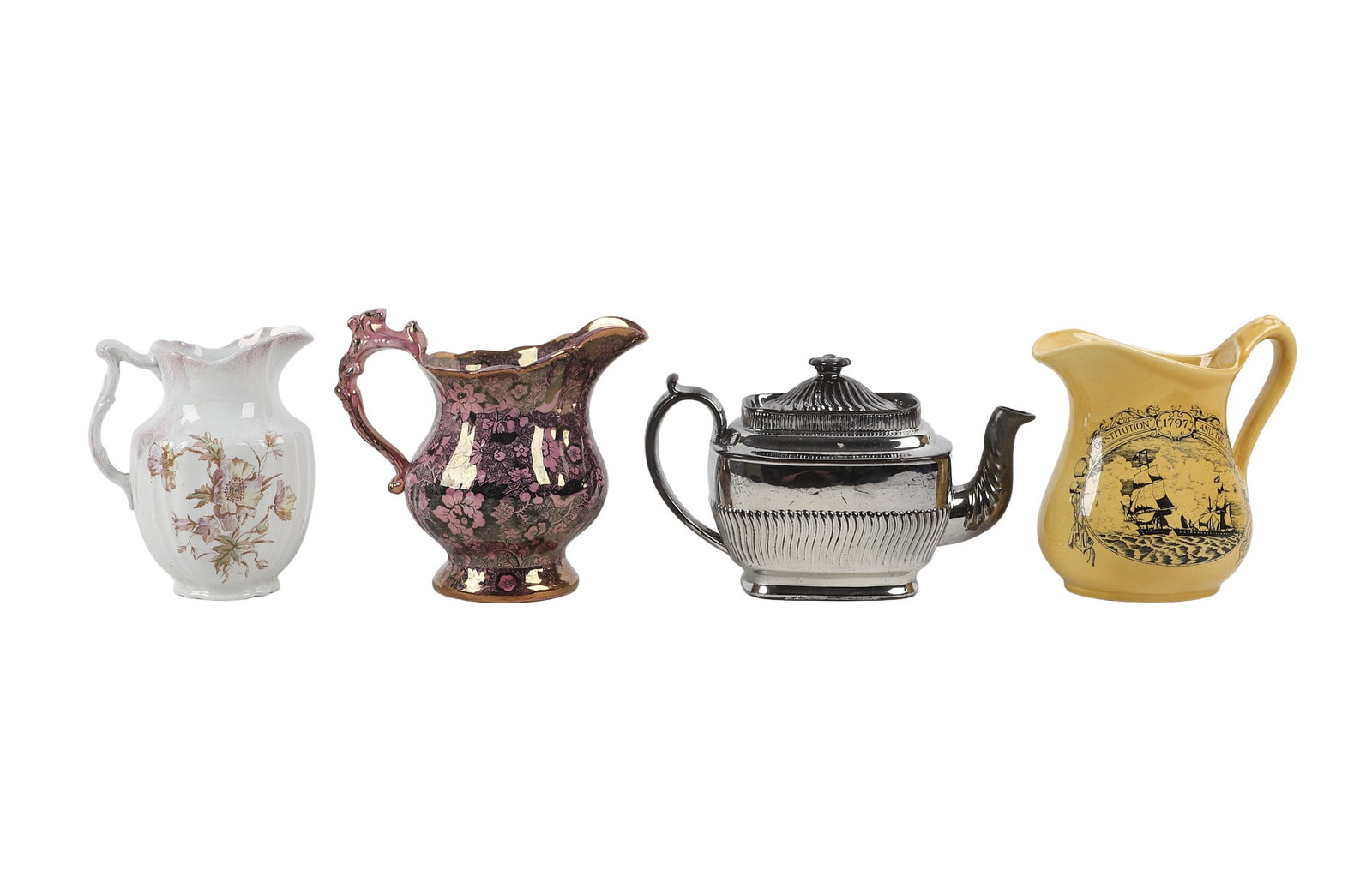 (4) Ceramic Pitchers & Teapot: (4) Ceramic Pitchers & Teapot (4) Ceramics lot to include (1) transferred pattern pink lusterware pitcher, (1) 'Constitution 1697 and The Java' pictorial pitcher from Royal Crawford Ironstone, (1)