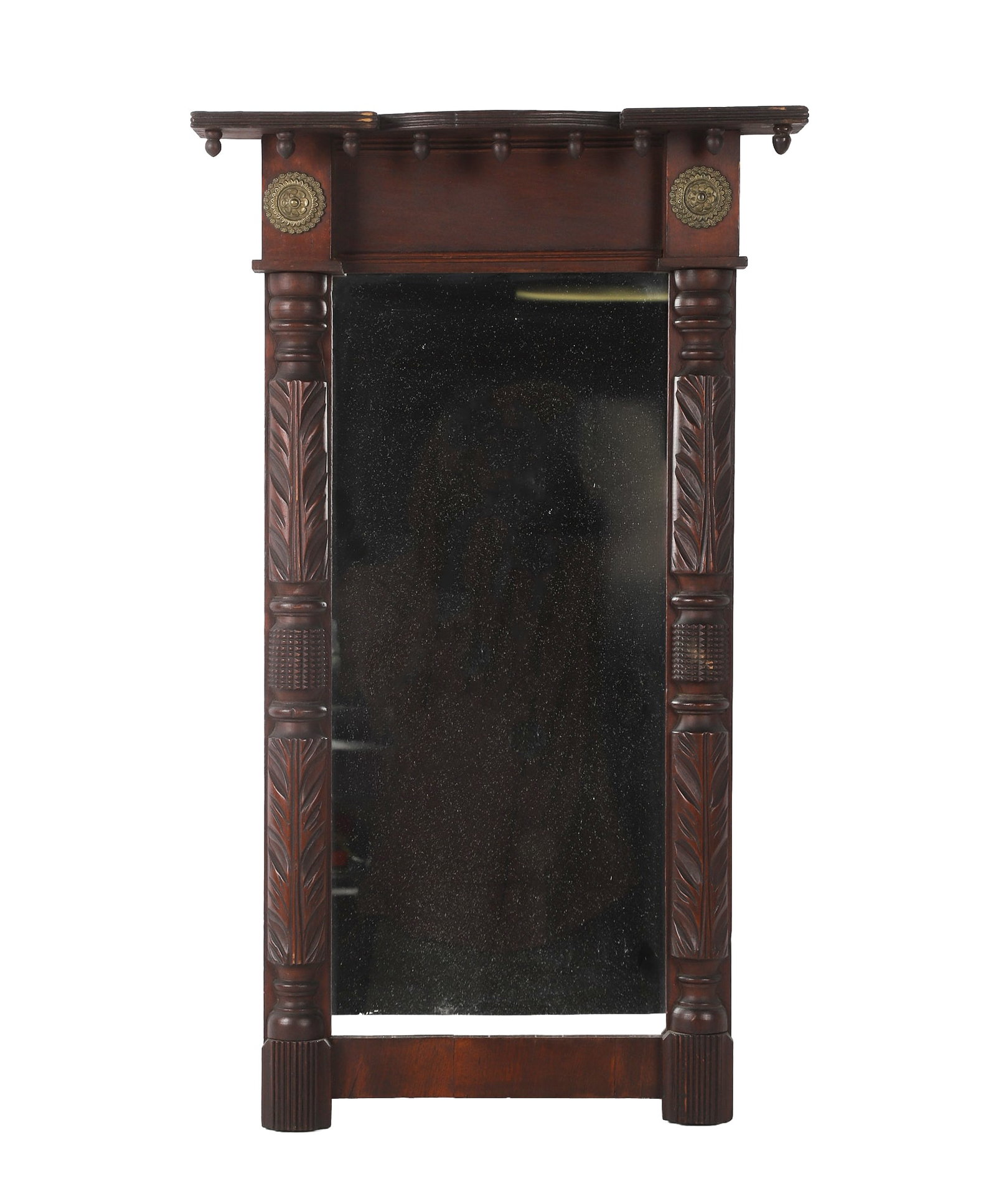 Antique American Empire Mirror: Antique American Empire Mirror 19th C carved mahogany frame featuring foliate pilasters with brass rondels supporting an eaved shelf having a ball apron. Overall 29" H x 17" W x 3" D.
