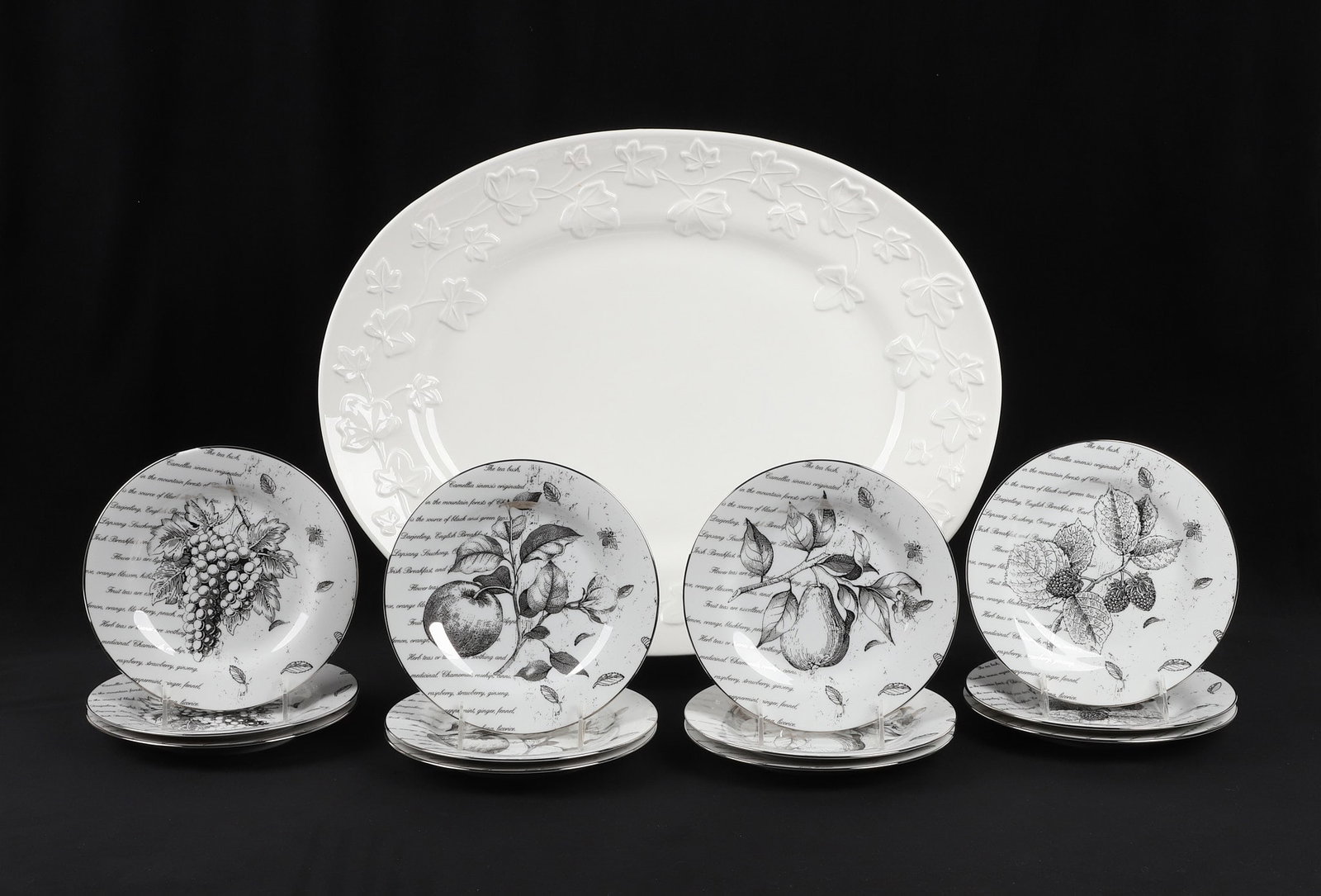 (12) Pottery Barn Fruit & Tea Plates w/ Oversize Platter: (12) Pottery Barn Fruit & Tea Plates w/ Oversize Platter (12) unique Pottery Barn 8 1/2" plates decorated with drawn fruit & script about tea. Also includes an oversize all white 22 3/4" x 17 5/8"